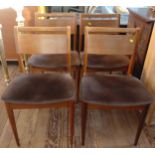 Four mid-century wooden back dining chairs