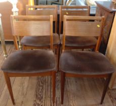Four mid-century wooden back dining chairs