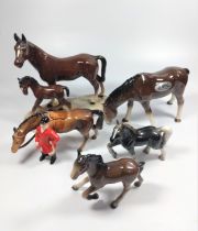 A Sylvac horse with silver label 20cm long and four other horses by different makers. (5)