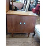 A teak cabinet. 56cm x 61cm x 35cm