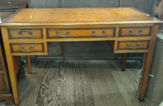 A Walnut Dressing Table. 77cm x 119cm x 59cm.