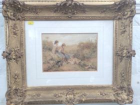 An ornate gilt-framed print