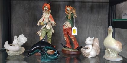A Poole dolphin 16.5cm long, Spanish Squirrel, duck and doves, and two clown musicians. (6)