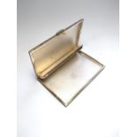 A Sterling silver cigarette case. Import marks. circa 1930. Engine turned decoration.