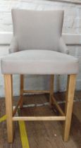 A tall upholstered stool