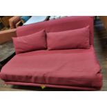 A red sofa bed. 80cm x 160cm x 106cm.