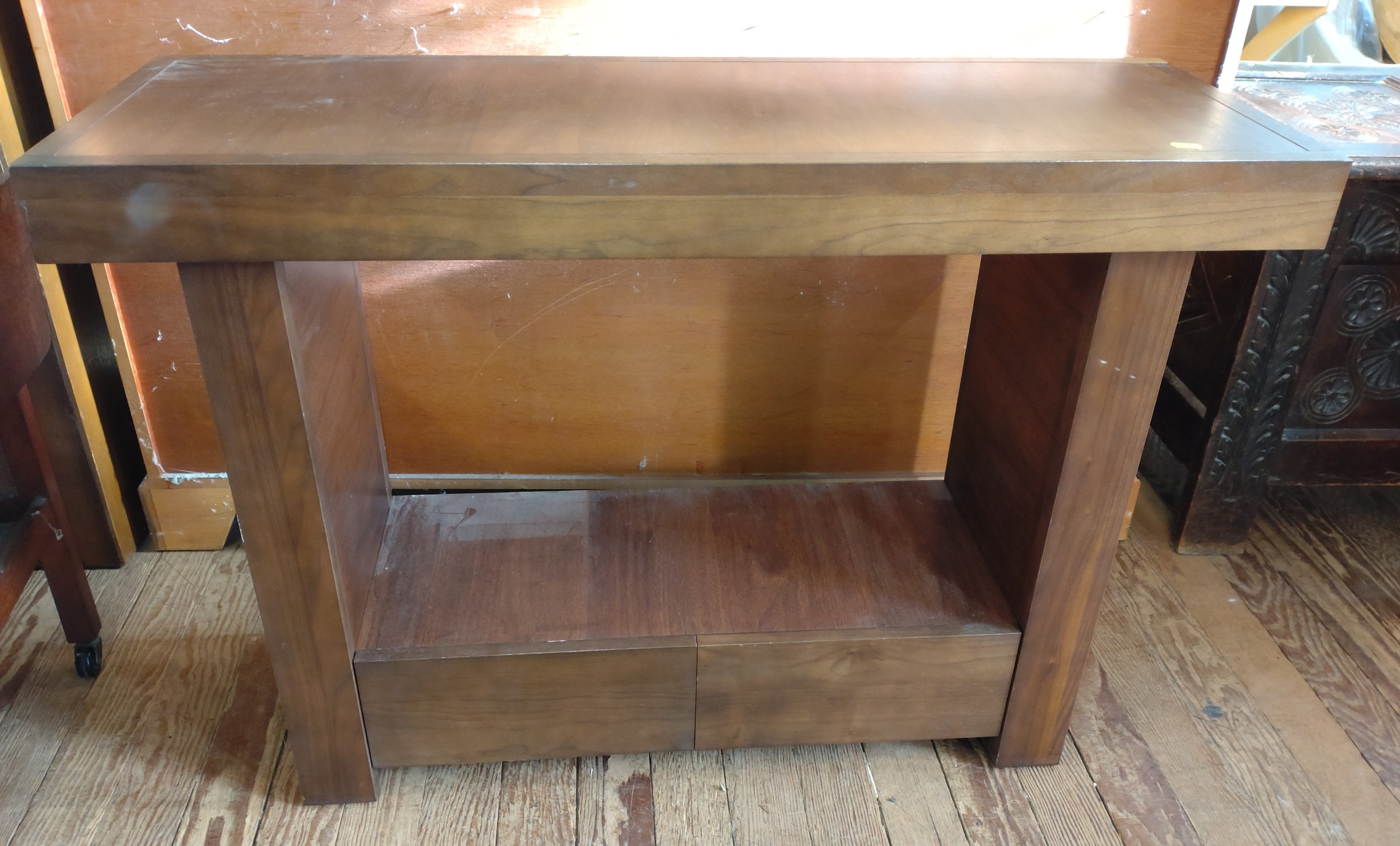 A hall table with drawers
