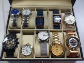 A collection of ten fashion watches in a leather presentation case