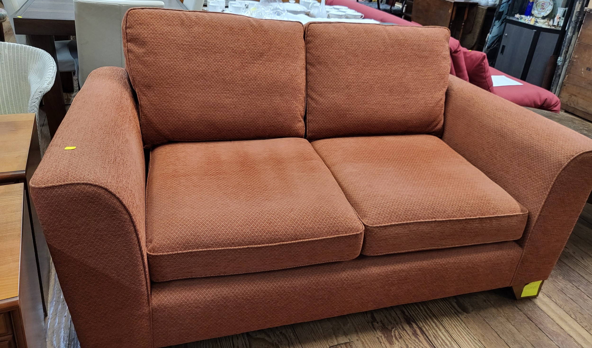 A two-seater sofa. 95cm x 185cm x 100cm