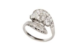 A diamond crossover dress ring, centred with a trio of cushion-shaped old-cut and round brilliant-