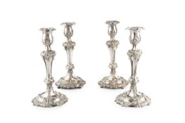 Two almost identical pairs of 18th century style silver plated candlesticks, with knopped stems, and