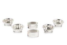 A set of four late Victorian silver salts, of shaped circular form on ball feet, by Atkin Bros,