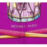 A 'Les Tambours' silk scarf by Hermès, designed by Joachim Metz, depicting a cluster of battalion