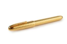 A gold plated fountain pen by Cartier, with reeded decoration, and with nib stamped '18k', no.