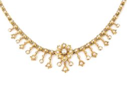 A late 19th/early 20th century half pearl fringe necklace, suspending a graduated fringe of