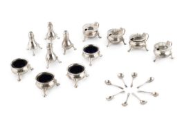 A silver twelve piece cruet set, comprising four each of peppers, mustards and salts, with blue