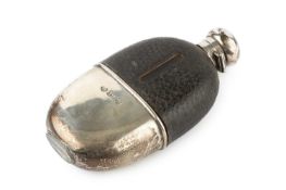 A late Victorian silver mounted hip flask, of oval form, having leather covered upper section and