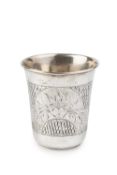 A late 19th century Russian silver beaker, of slightly tapered form, engraved with two shaped