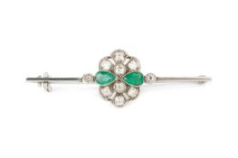 An emerald and diamond cluster bar brooch, the uniform bar centred with a pierced and millegrained