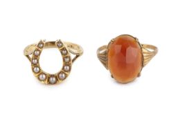 Two gem set dress rings, the first modelled as a horseshoe of graduated half pearls, adapted with