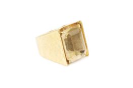 A citrine single stone dress ring, the rectangular step-cut citrine in four claw setting, to a