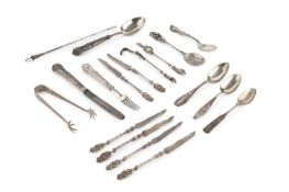 A set of six George V silver fruit knives, with figural twist handles by Harry Freeman, London 1911,