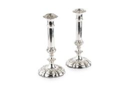 A pair of late Victorian silver plated candlesticks, with scrolling foliate knopped columns and