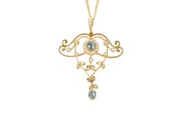 An aquamarine and half pearl pendant, the openwork scrolled panel centred with a cushion-shaped