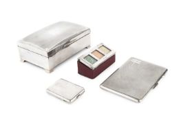 An Edwardian silver mounted stamp box, the sloping top inset with three glazed compartments, two