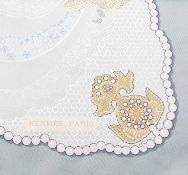 A 'Doigts de Fée' silk scarf by Hermès, designed by Caty Latham, of lace and pearl design, in shades