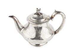 An early Victorian silver bachelor's teapot, of baluster form, engraved with flowers and scrolling