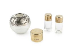 An Edwardian silver-gilt cylindrical small box by Asprey, London 1904, 3.8cm wide, with a pair of