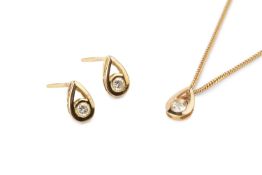 A diamond pendant necklace and ear studs suite, of teardrop design, collet set with round