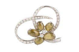 A diamond and gem set spray brooch, modelled as a cluster of oval chatoyant cabochons centred with