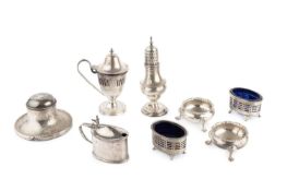 A George V silver urn shaped mustard, with pierce-decorated body, domed hinged cover and blue