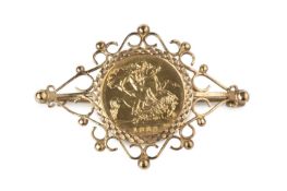 A half sovereign brooch, the Elizabeth II half sovereign dated 1982, loose mounted to a 9ct gold