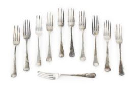 A set of eleven George V silver old English pattern dessert forks, by Josiah Williams & Co, London