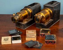 Two JW London made magic lanterns together with slides
