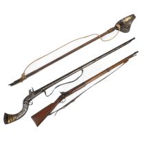 A musket, a Jezail and a dress sword