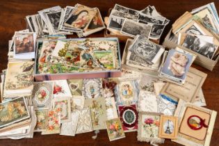 A large collection of postcards and cut-out paper