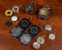 A collection of military compasses