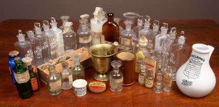 A collection of approximately thirty apothecary bottles