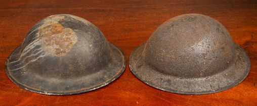 Two old tin helmets