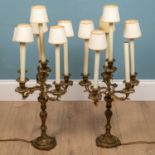 A pair of Rococo style continental gilt metal candelabra style lamp holders