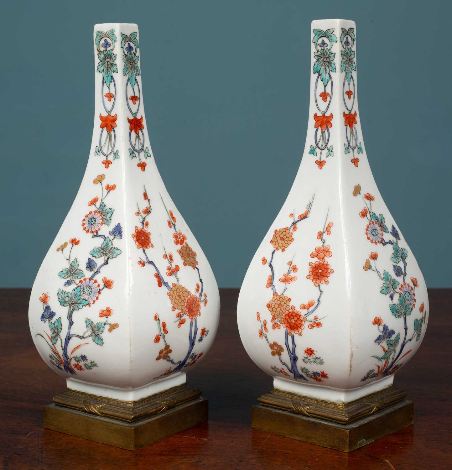 A pair of French porcelain bottle vases