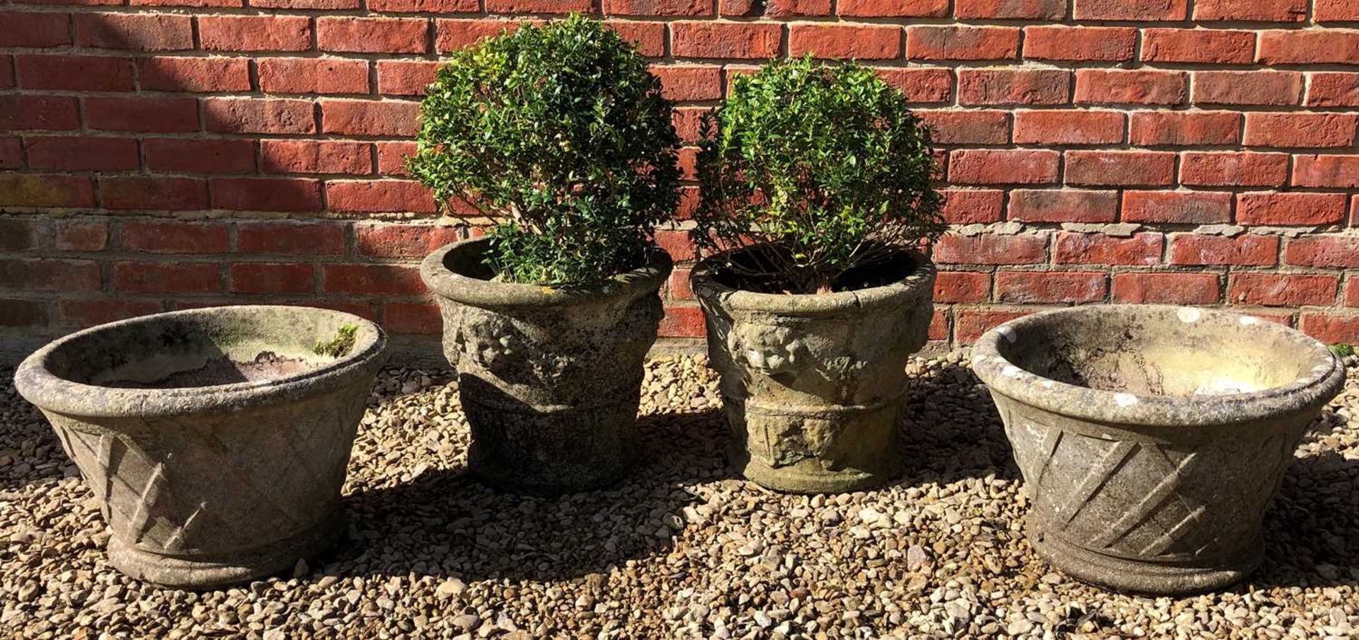 Two pairs of cast reconstituted stone planters