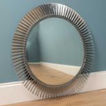 A convex chrome turbine style wall mirror