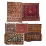 A Middle Eastern flatweave rug and six further Persian mats