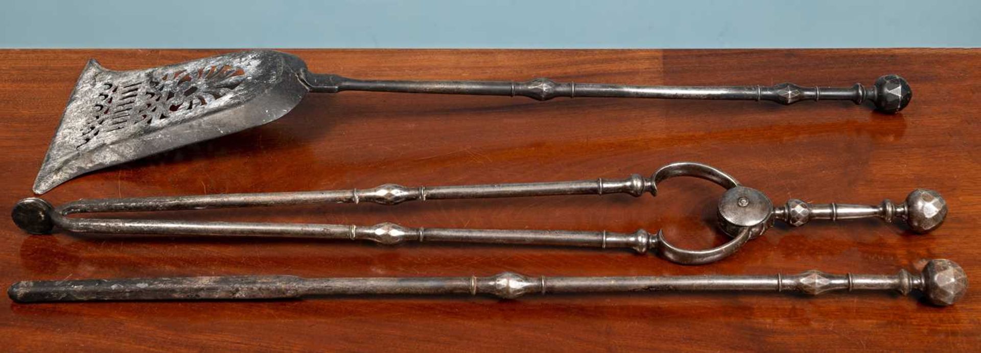 A set of Three Georgian steel fire irons