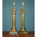 A pair of large brass corinthian table lamps